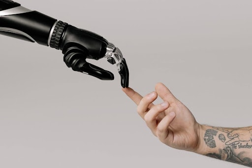 bionic arm touching human arm